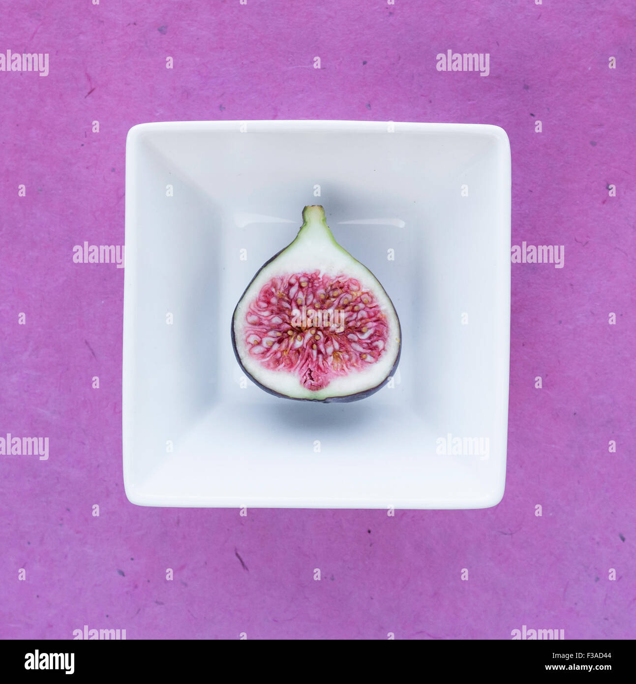 Halved fig in a bowl Stock Photo