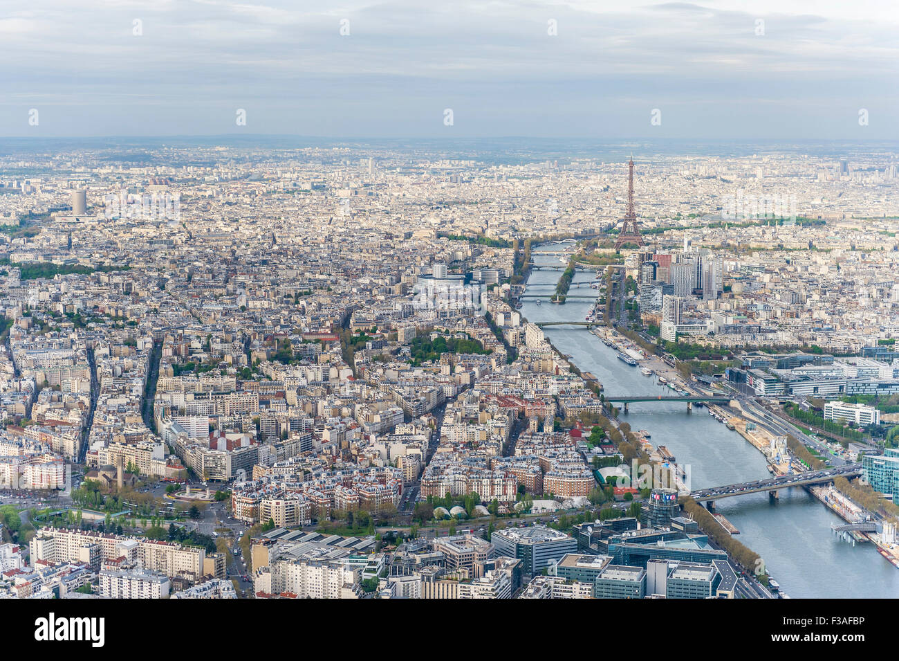 Aerial view of Paris city center with the Seine river and its bridges in the foreground and the