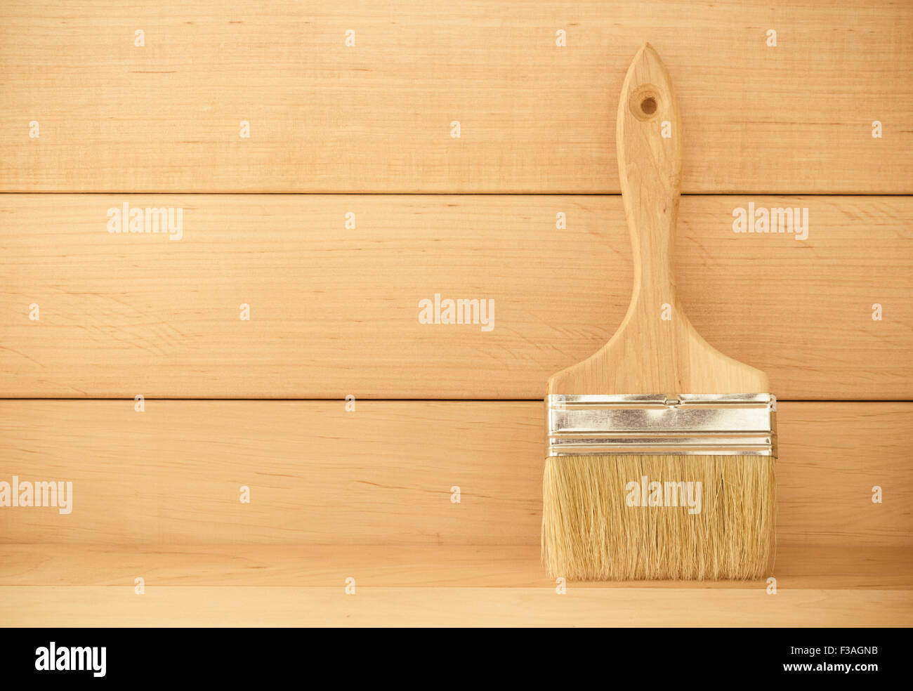 paint brush on wooden background Stock Photo - Alamy