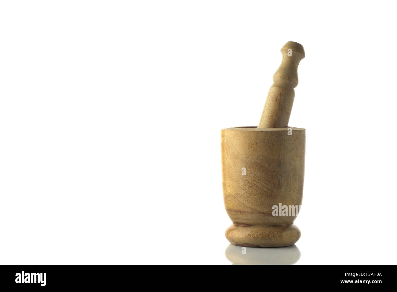 Light Brown Wooden Mortar and Pestle on White Background Stock Photo