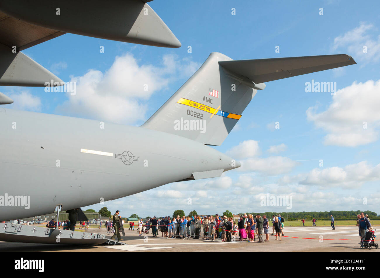 The tail of a McDonnell Douglas/Boeing C-17 Globemaster III towers above spectators at RNAS Yeovilton Air Day 2015 Stock Photo