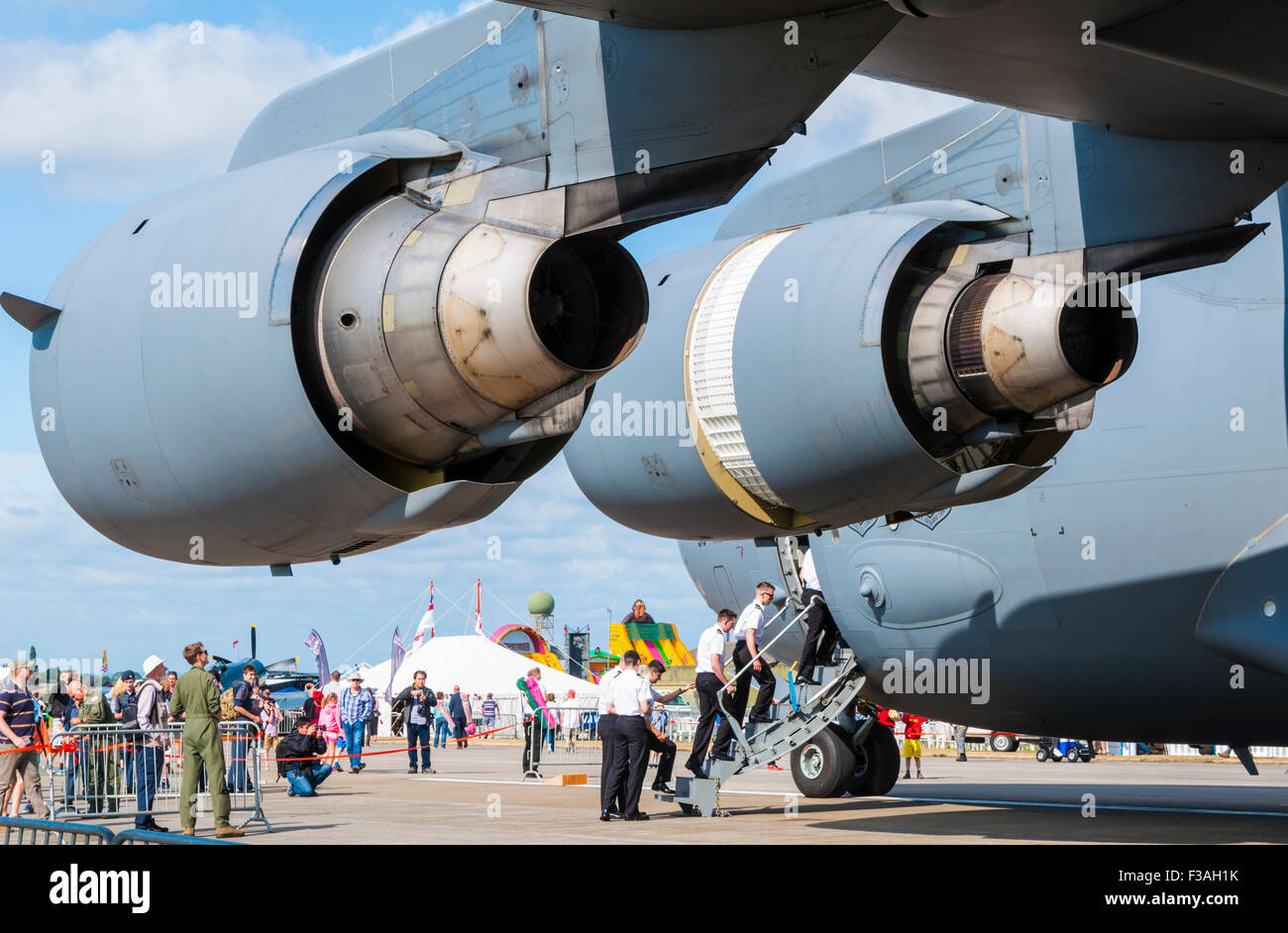 The two port engines of a McDonnell Douglas/Boeing C-17 Globemaster III with the inner engine configured for reverse thrust Stock Photo