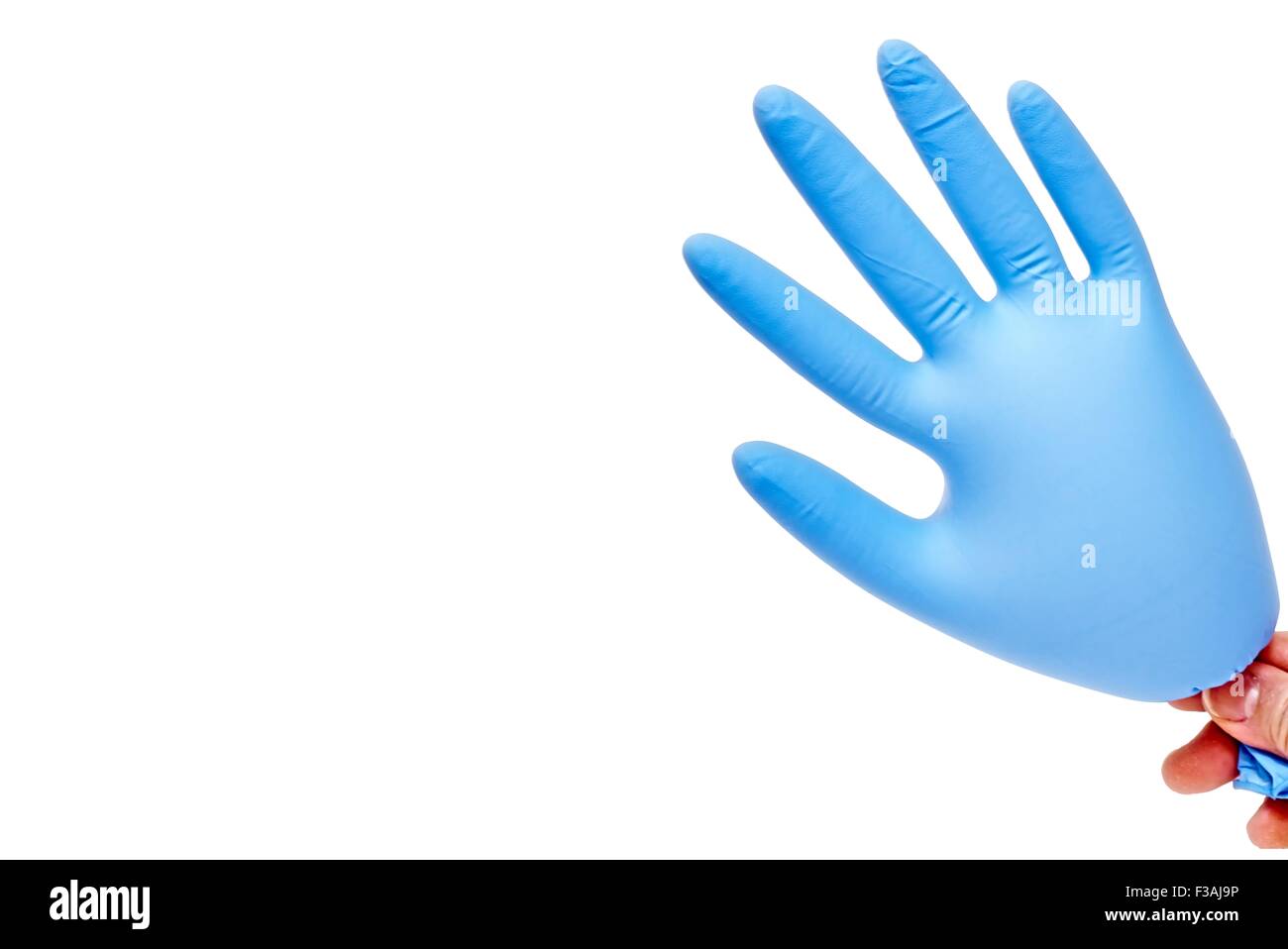 Hand Holding Blown Up Latex Glove Blue Stock Photo