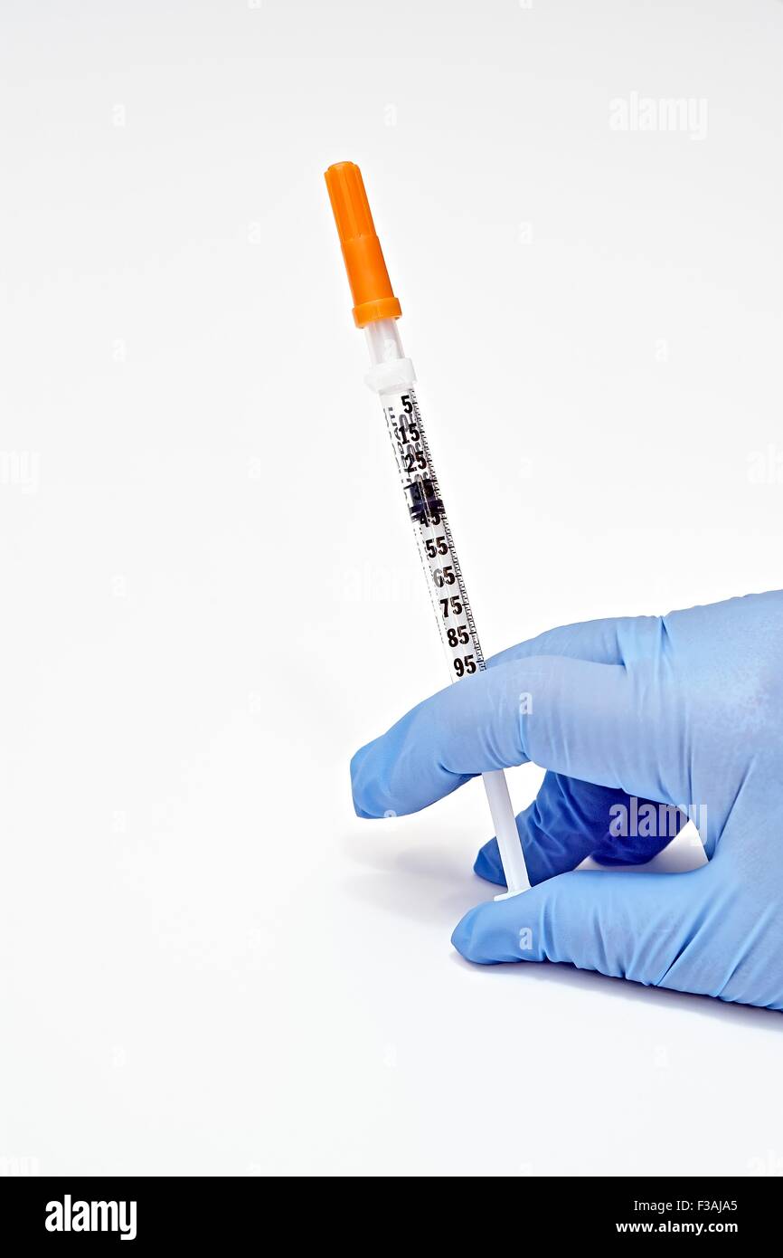 Hand Held Insulin Syringe Injection Needle Diabetic Latex Glove Blue Stock Photo