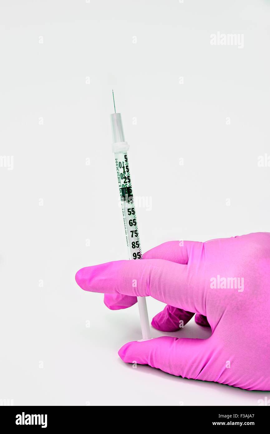 Hand Held Insulin Syringe Injection Needle Diabetic Latex Glove Pink Stock Photo