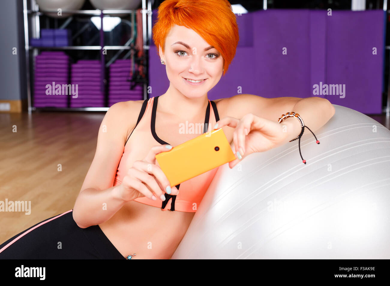 Beautiful Young Fitness Woman With Short Haircut Wearing In Top
