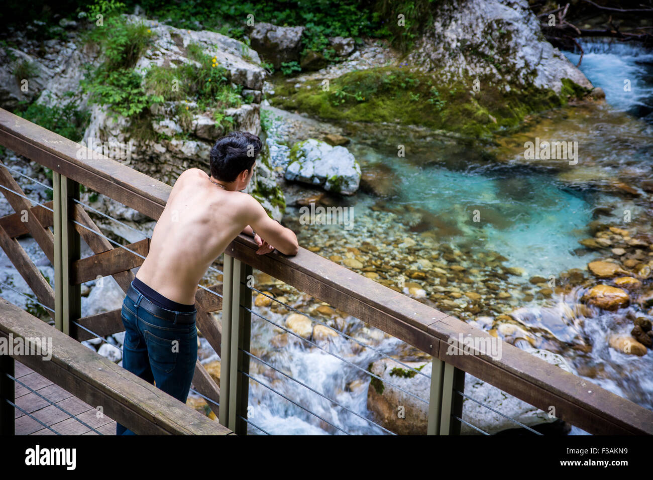 High Angle View of a Shirtless Athletic Young Man Leaning Against ...