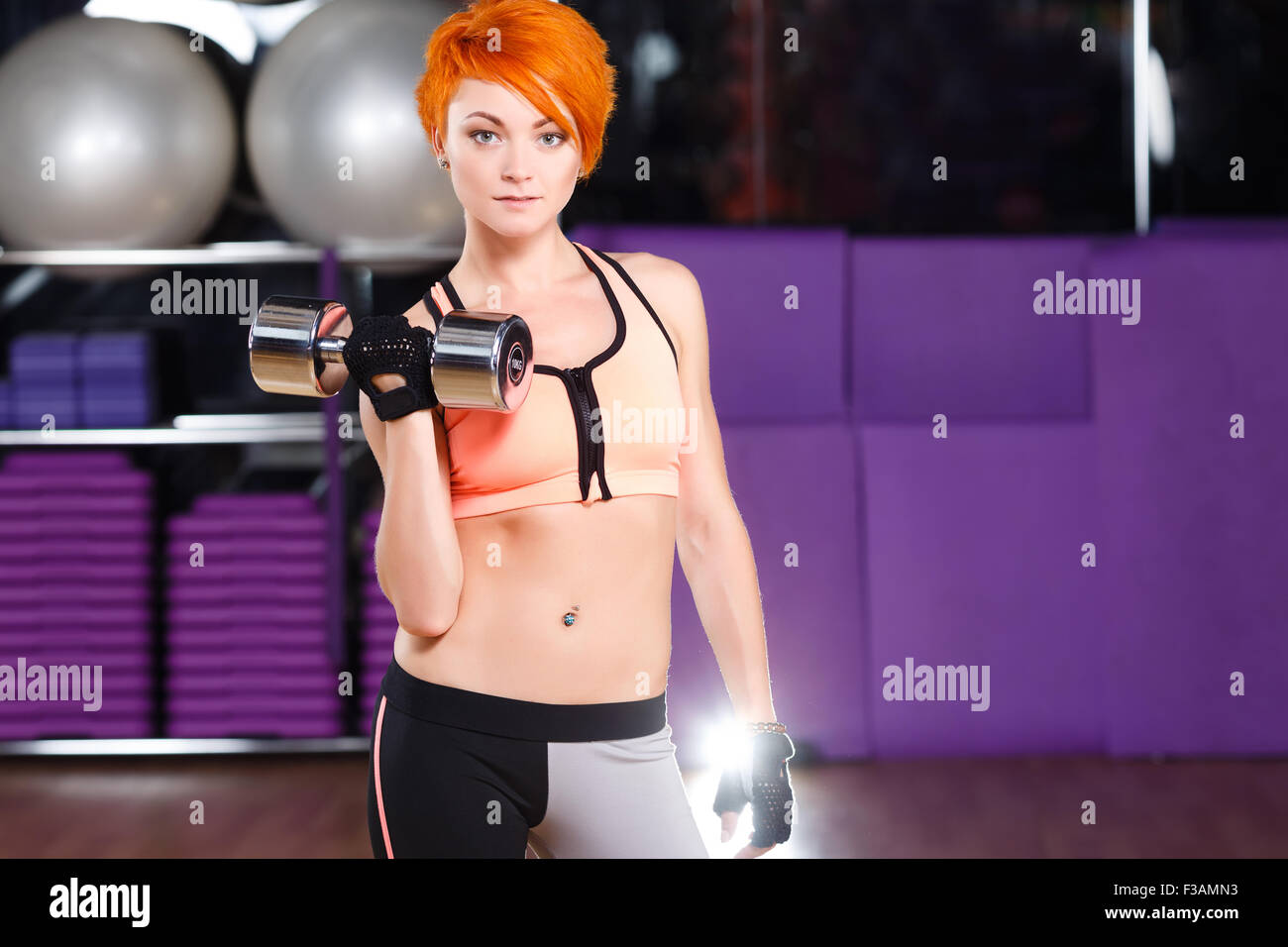 Young Redhead Woman With Short Haircut Wearing In Top And