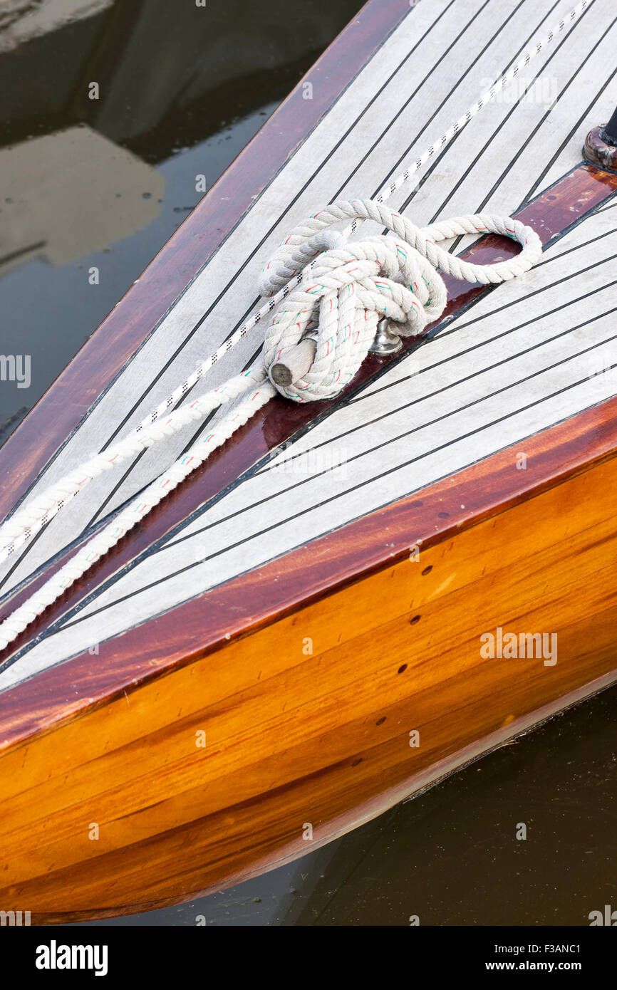 Knot of a white rope on a wood yacht Stock Photo