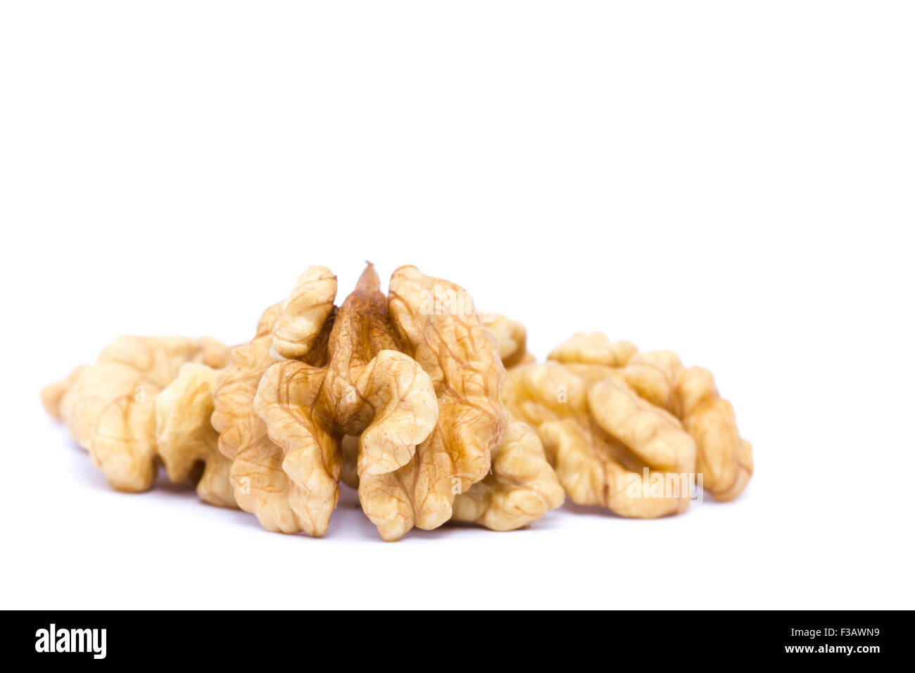 Small group of walnuts on a white background. Stock Photo