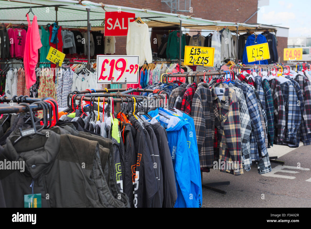 Clothing for sale at a market stall in Bristol, UK Stock Photo