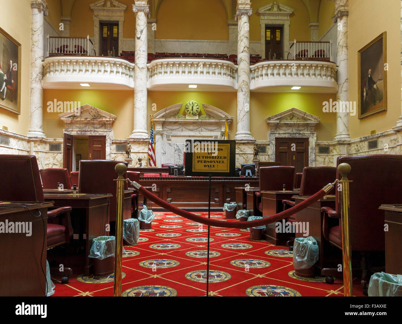 Senate Chamber carpet red and white, the Crossland colors of the Maryland Flag. Woven into the carpet is the Great Seal of 1648 Stock Photo