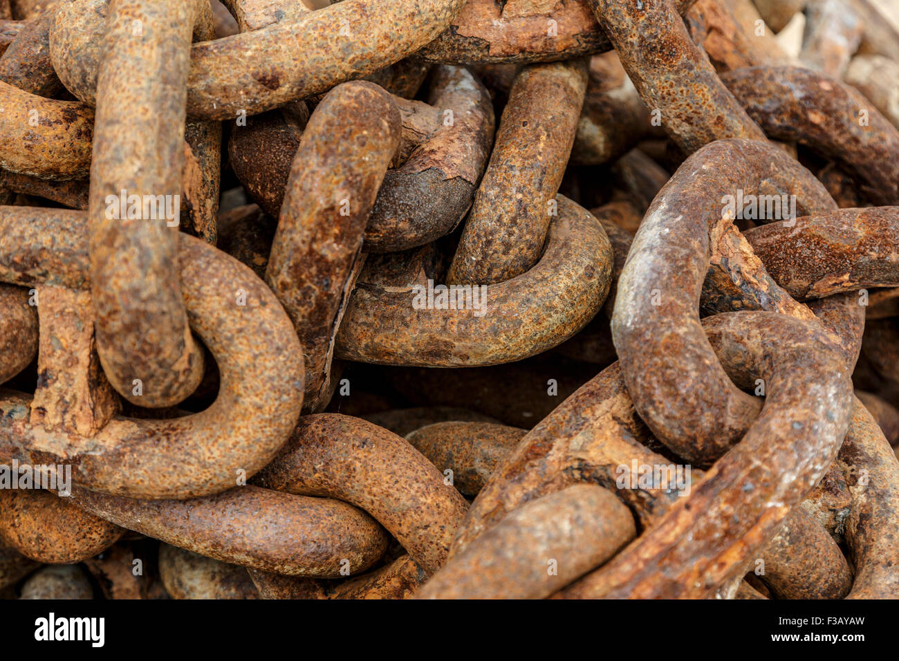 Rusty chain links in a pile close up Stock Photo Alamy