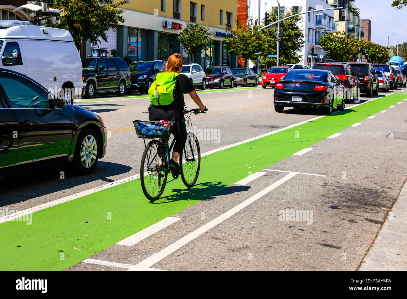 The bright green bicycle lane in downtown Santa Monica California Stock