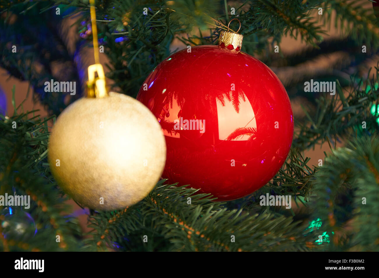 Golden and red balls on the Christmas tree Stock Photo