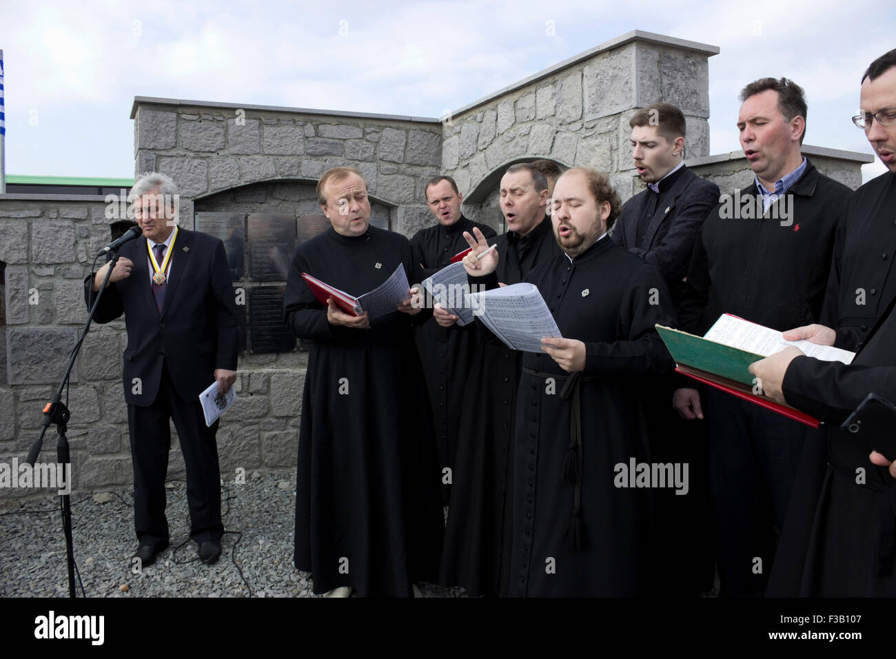 Lemnos island, Greece. 3rd October, 2015. Russian ecclesiastic choir performing live at the memorial service held for the fallen Russo-cossacks and Mr. Leonid Reshetnikov RISS (left) praying on Russo-Kozak memorial site. Lemnos, Greece. Credit:  BasilT/Alamy Live News Stock Photo