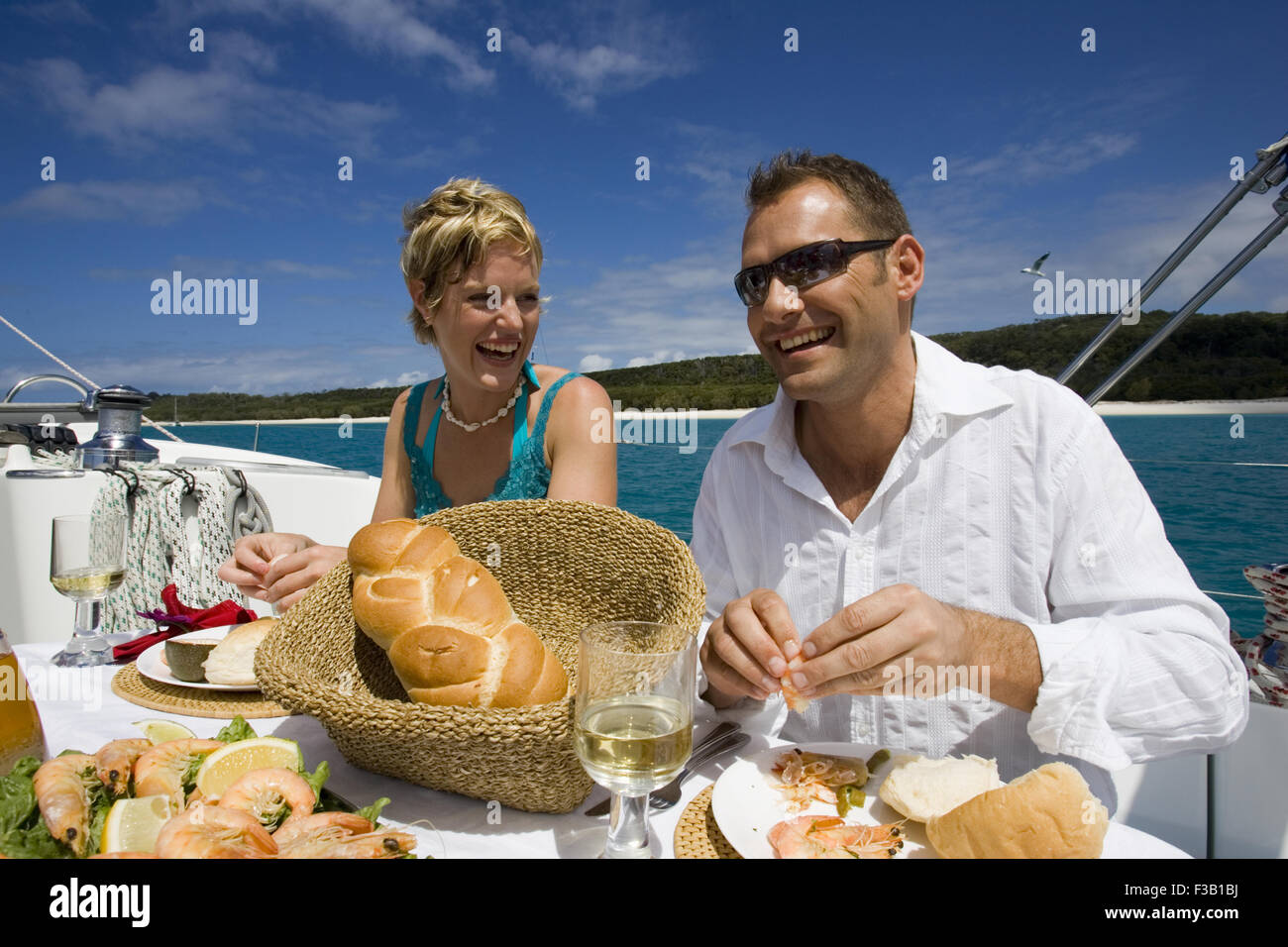 Couple having a friendly lunch on a yacht Stock Photo