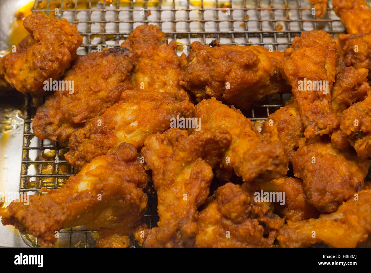 Deep fry basket of crispy fried chicken wings and legs Stock Photo Alamy