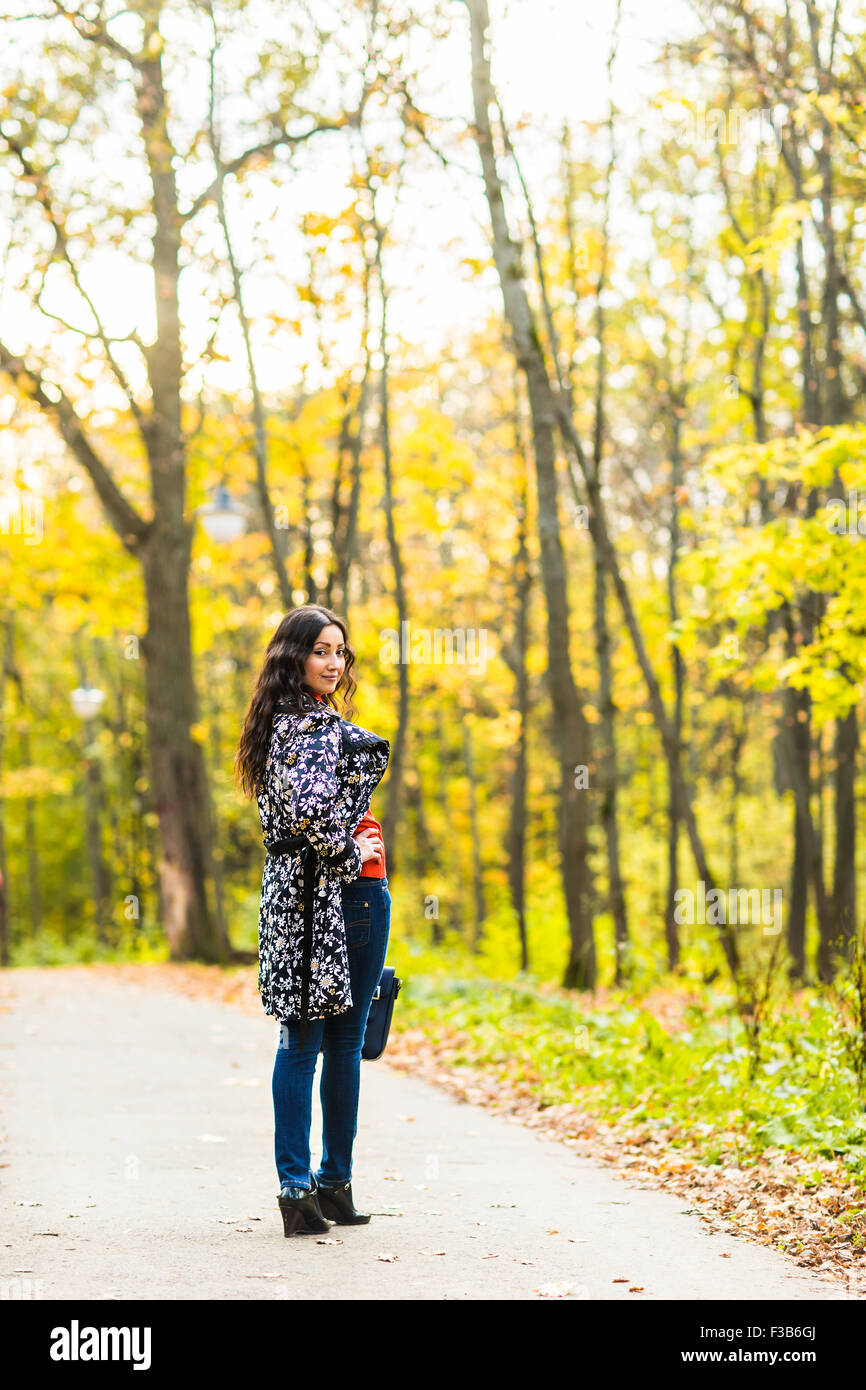 Woman walking happy in a park Stock Photo - Alamy
