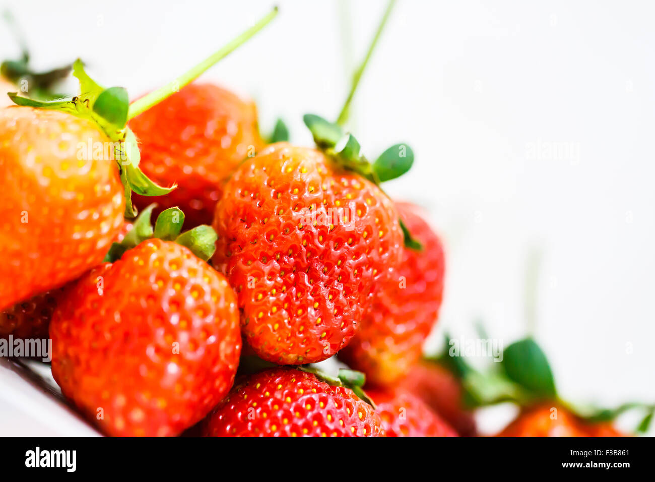 Strawberry berries on a white background Stock Photo - Alamy