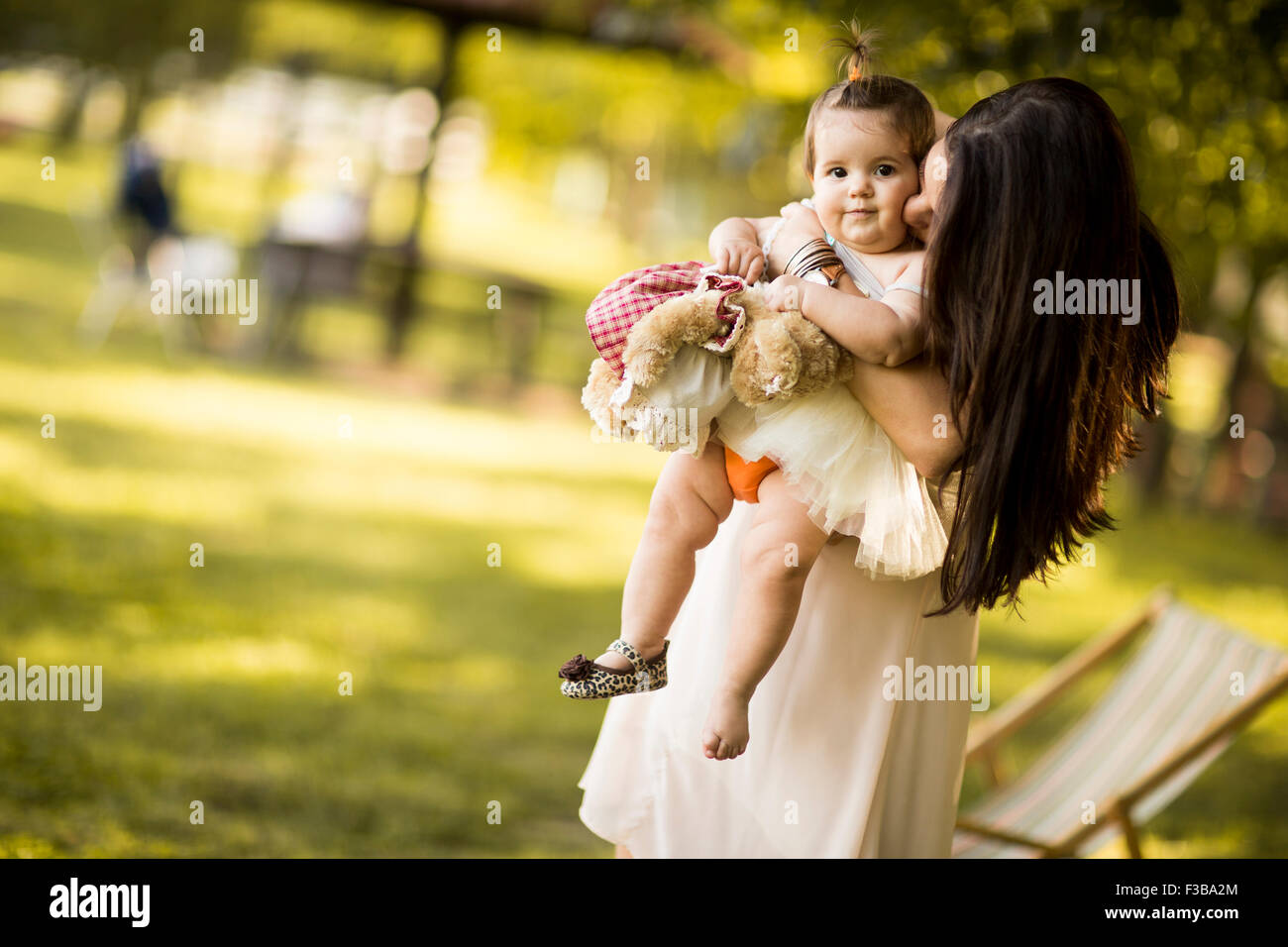 Mother and baby in the summer park Stock Photo