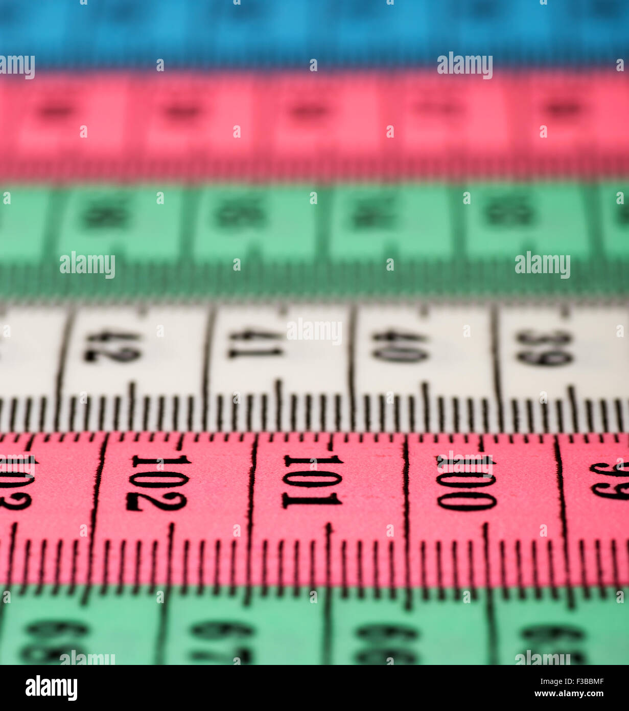 Different colors of Tailor measuring tapes.Shallow DOF Stock Photo