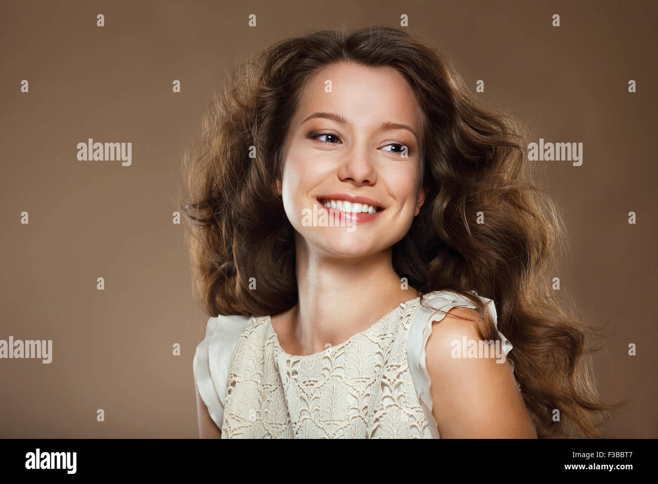 Toothy Smile. Portrait of Happy Lovely Brunette Stock Photo