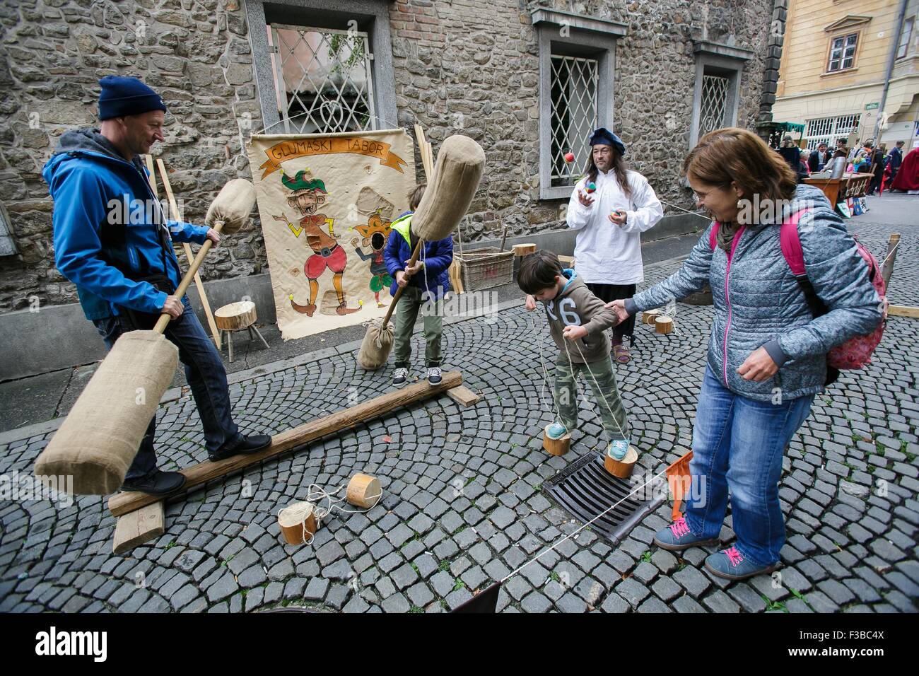 Ljubljana, Slovenia. 3rd Oct, 2015. People play at the buffoon camp at the  16th Medieval Day in Ljubljana, Slovenia, Oct. 3, 2015. The traditional  16th Medieval day in Ljubljana, one of many