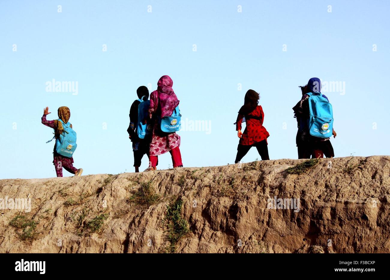 Nangarhar, Afghanistan's Nangarhar province. 3rd Oct, 2015. Children walk to an open air school in Jalalabad, capital of east Afghanistan's Nangarhar province, Oct. 3, 2015. Nearly 3.5 million Afghan children, according to UNICEF, are out of school, although the country has made tremendous achievements in the education field over the past 14 years. © Safi/Xinhua/Alamy Live News Stock Photo