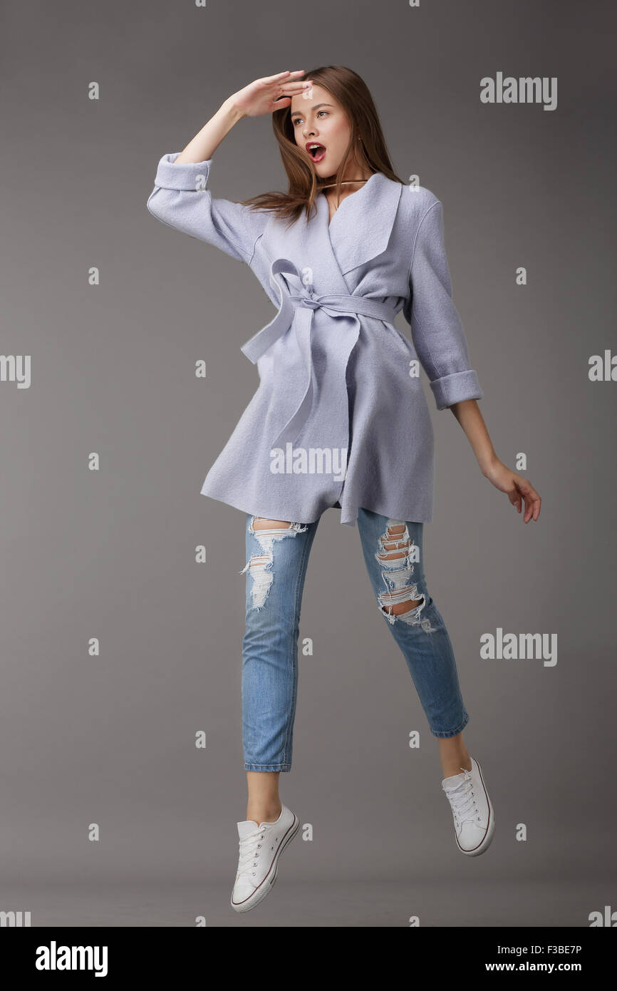 Emotional Young Woman in Outer Garments Stock Photo