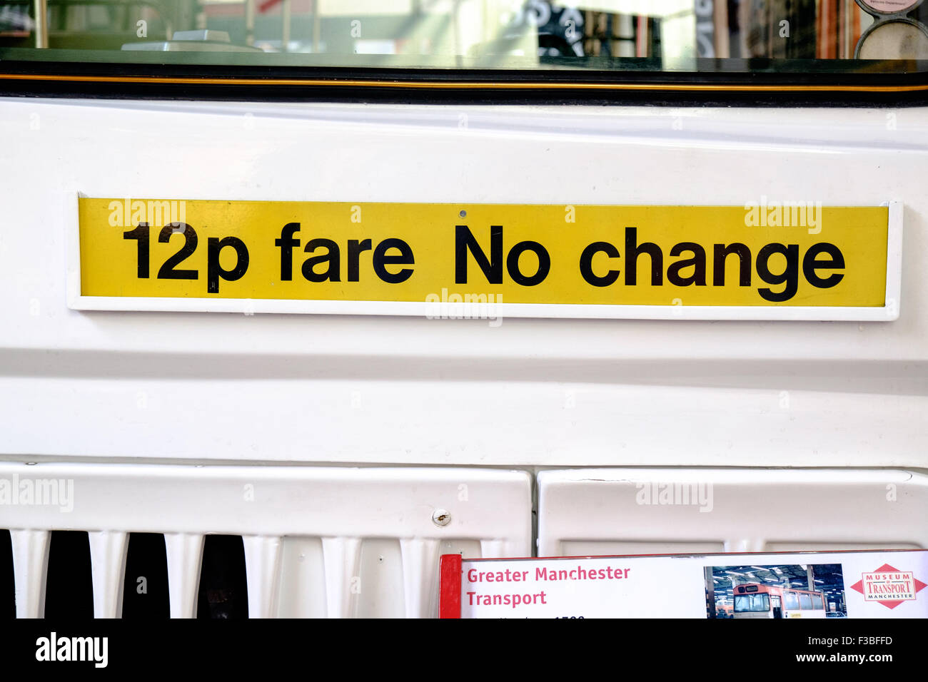 Sign saying '12p fare No change' on bus at Museum of Transport, Manchester, UK Stock Photo