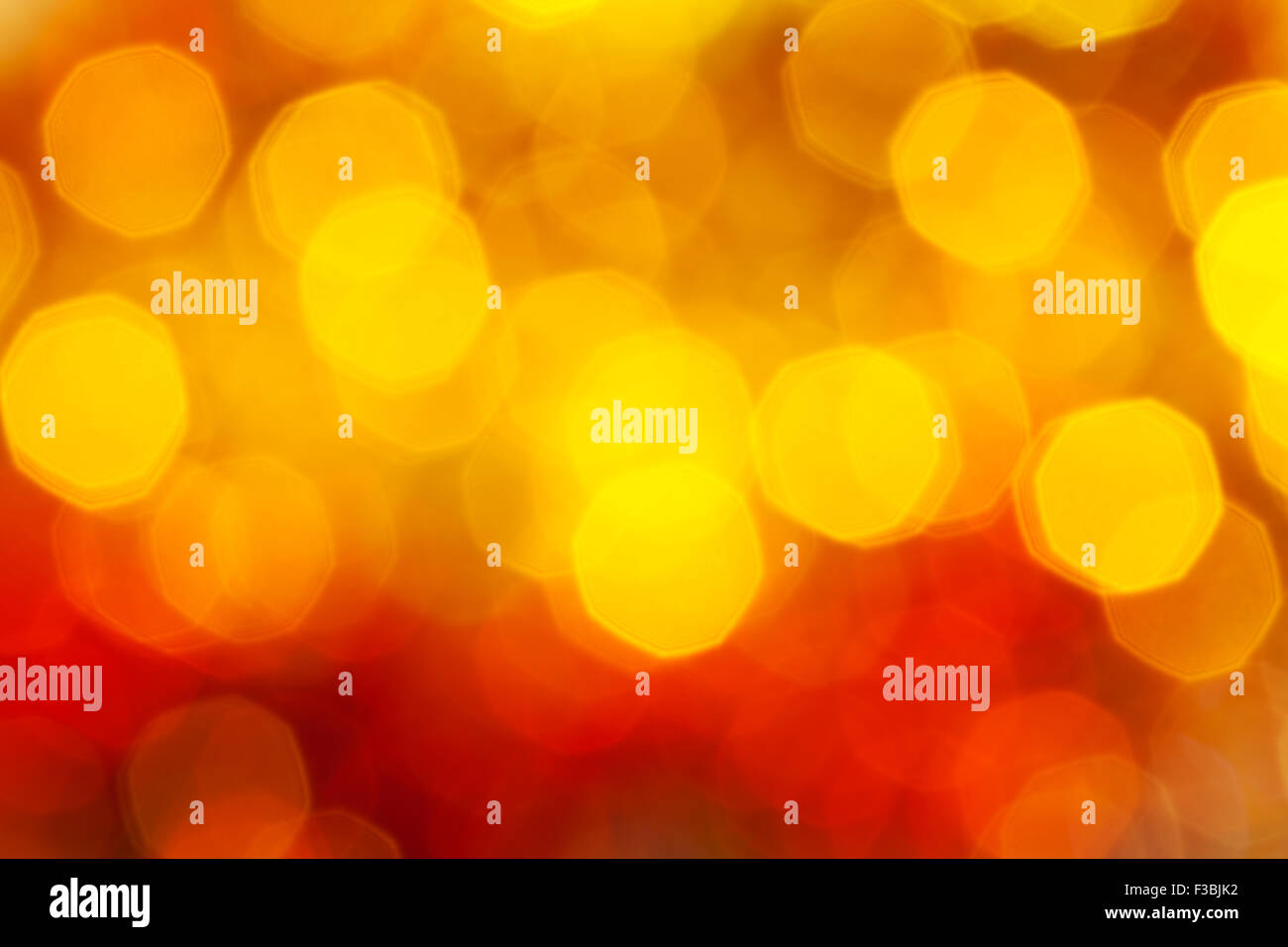 abstract blurred background - big red and yellow twinkling Xmas lights bokeh of garlands on Christmas tree Stock Photo