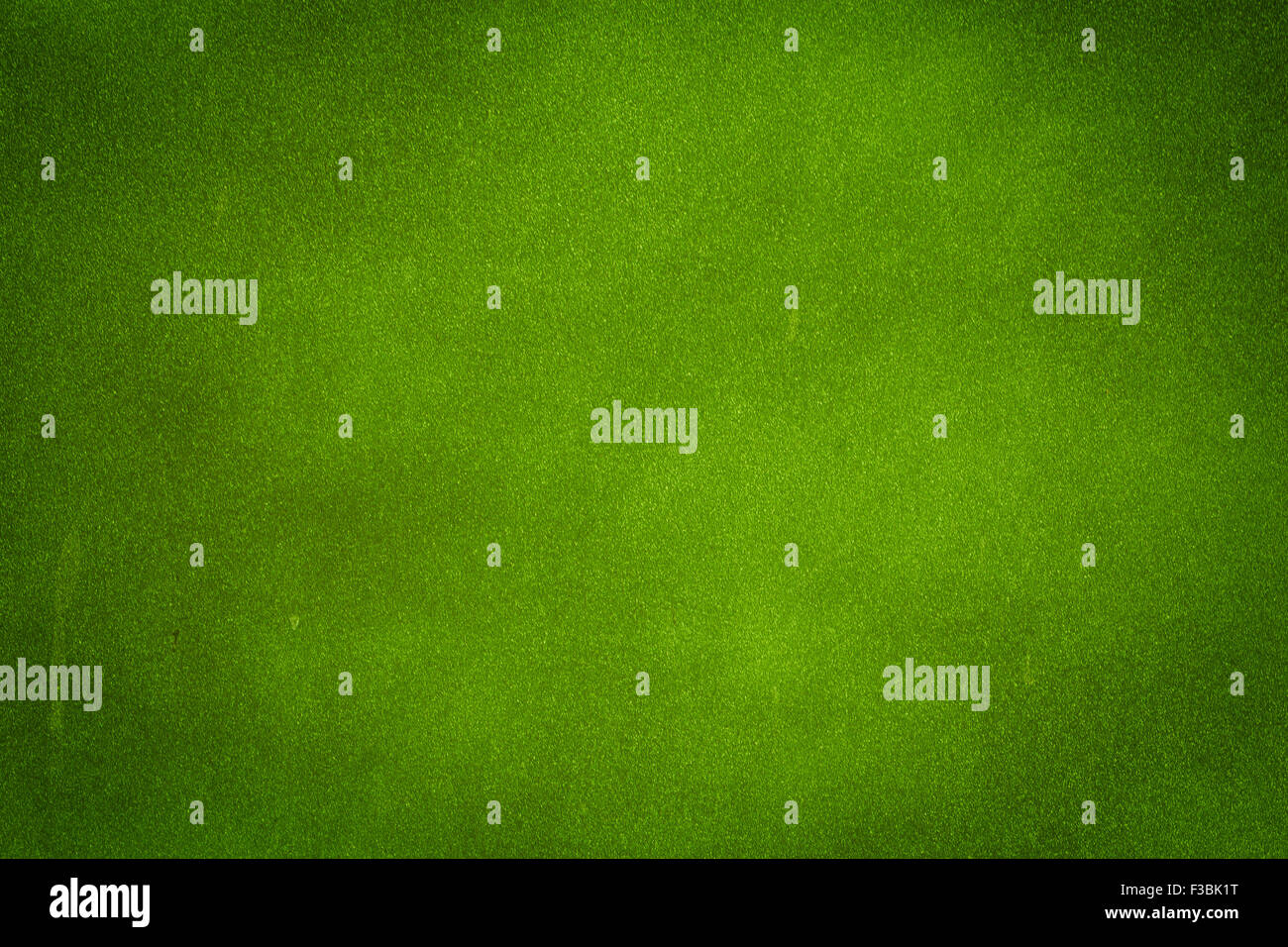 Green grunge wall background with dark spots Stock Photo