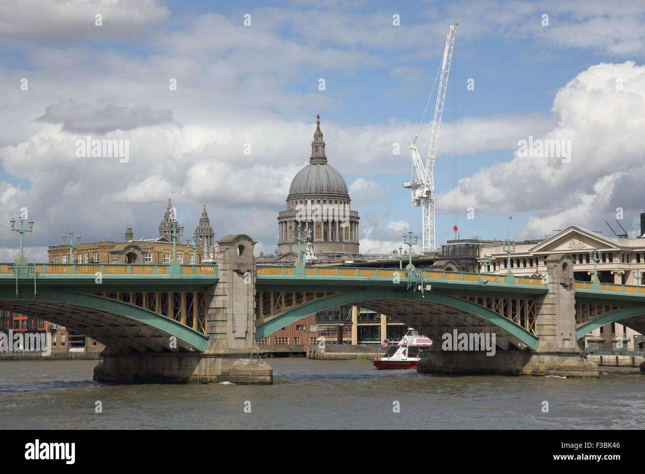 st pauls, cranes and southwark bridge across the river thames London