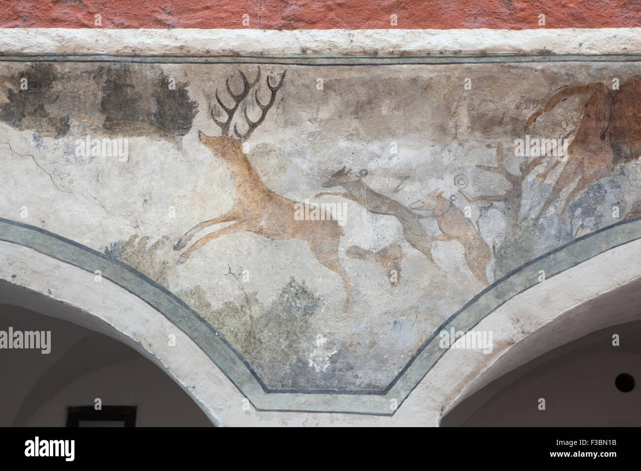 Stag hunting with hounds depicted on the medieval house in Piaristicka Street in Ceske Budejovice, South Bohemia, Czech Republic Stock Photo