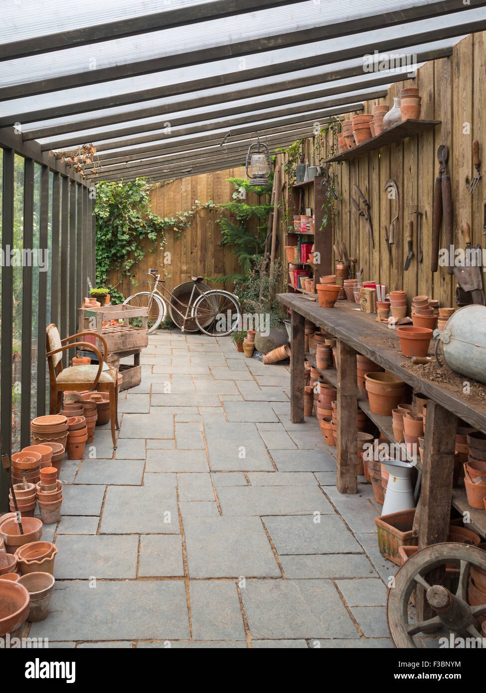 Old style clay pots store in a kind of garden warehouse Stock Photo