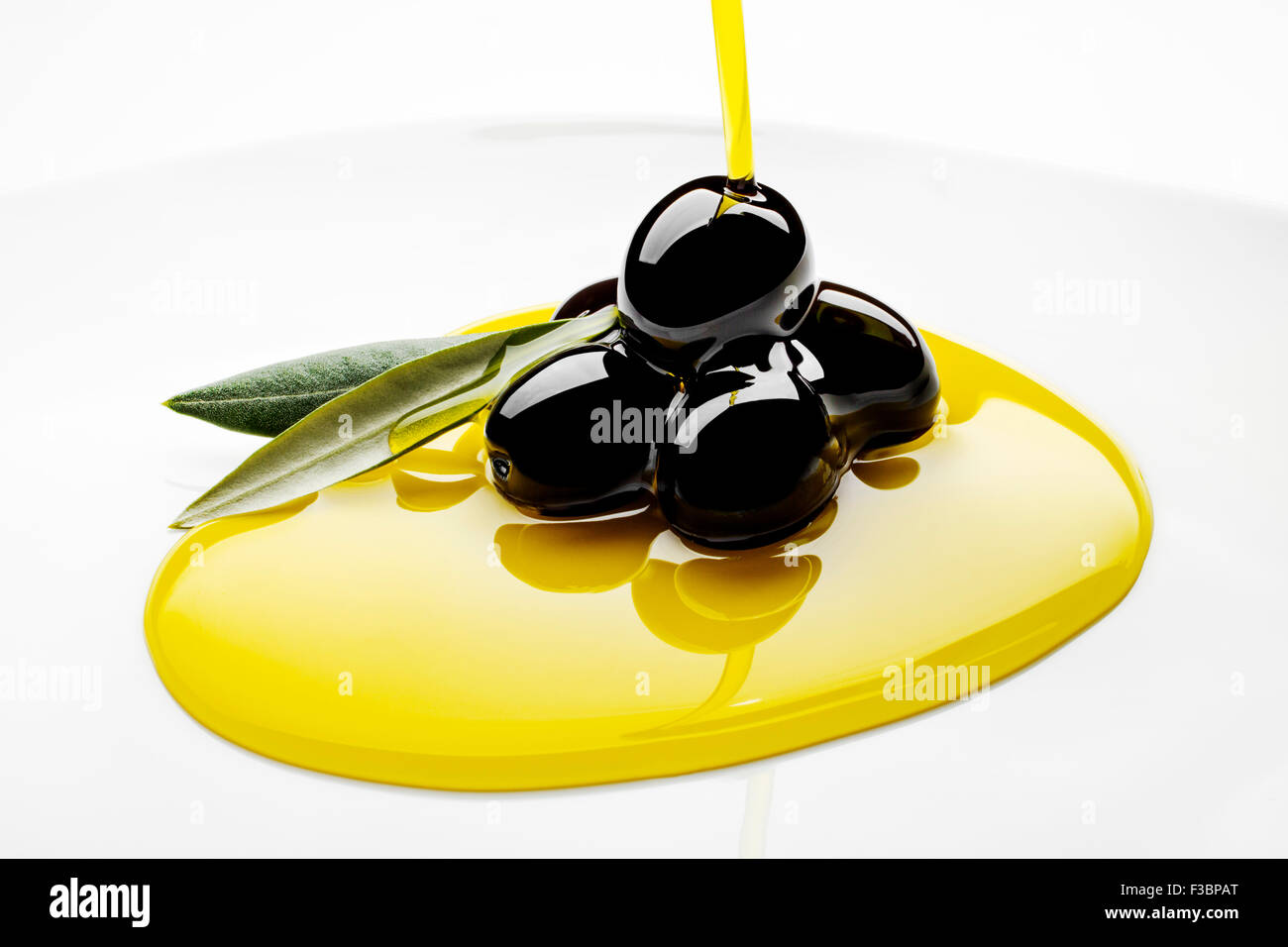 Black olives extra virgin olive oil Stock Photo Alamy