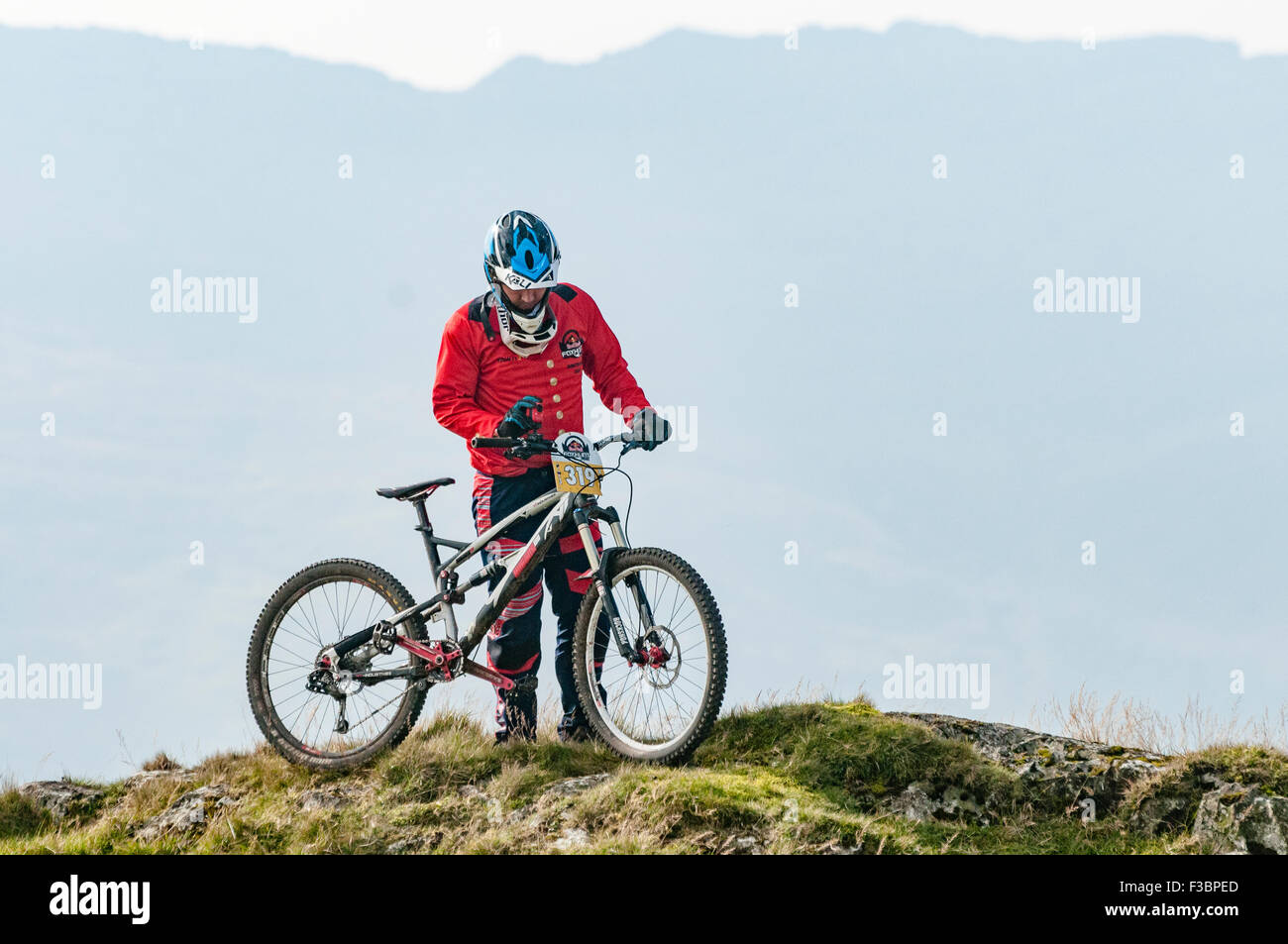 Rostrevor, Northern Ireland. 04 Oct 2015 - A competitor on the top of Slieve Martin at the start of the Red Bull Foxhunt mountain bike downhill challenge Credit:  Stephen Barnes/Alamy Live News Stock Photo