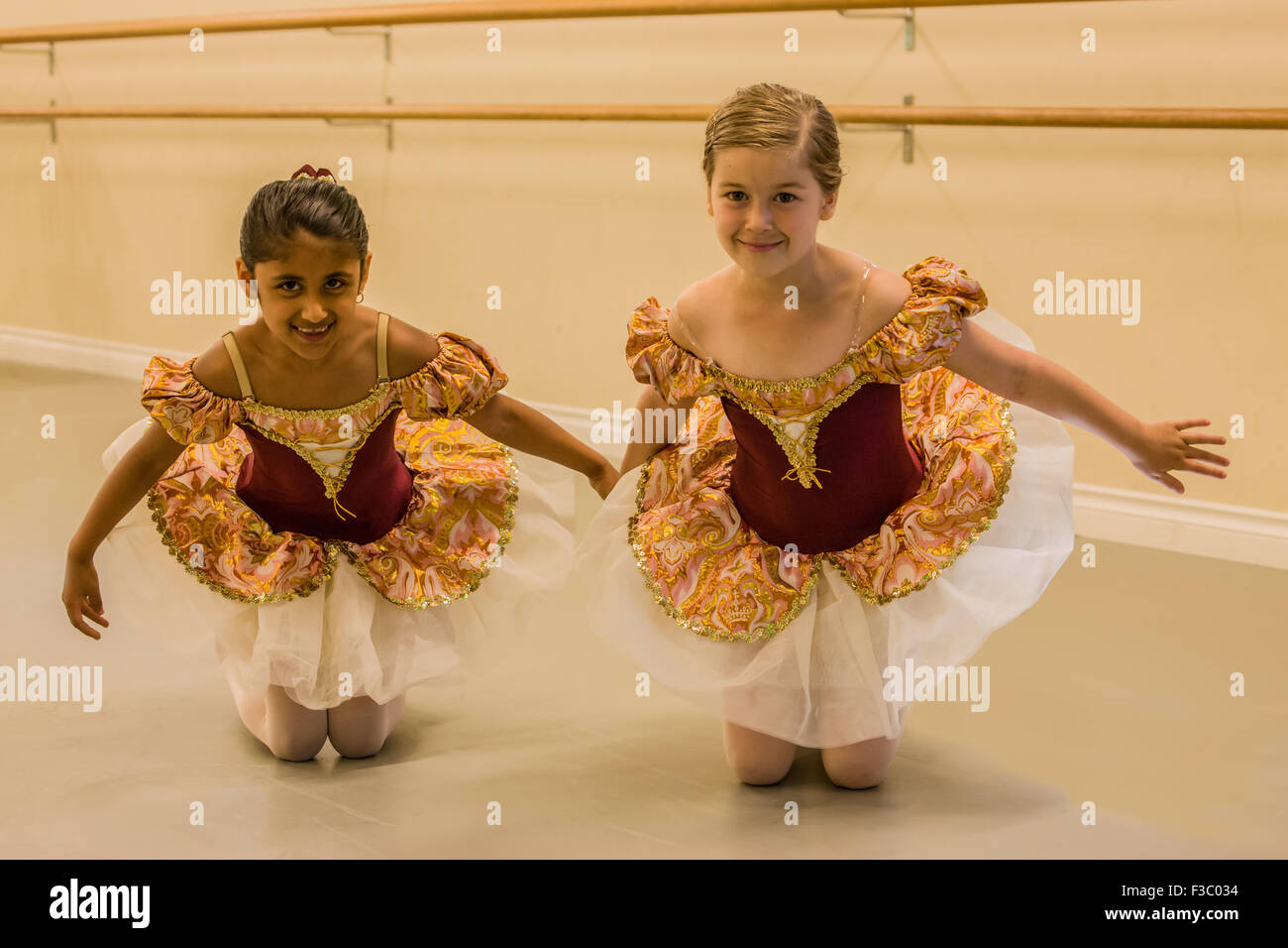 Seven year old girls at a ballet dance dress rehearsal in a studio in