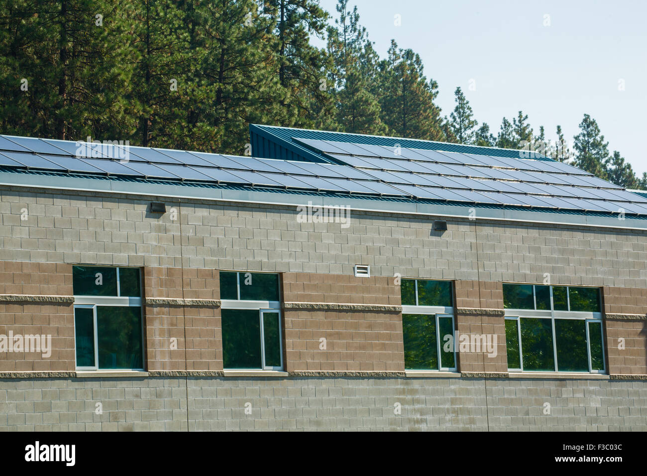 Solar panels on the roof of Icicle River Middle School, Leavenworth, Washington, USA Stock Photo
