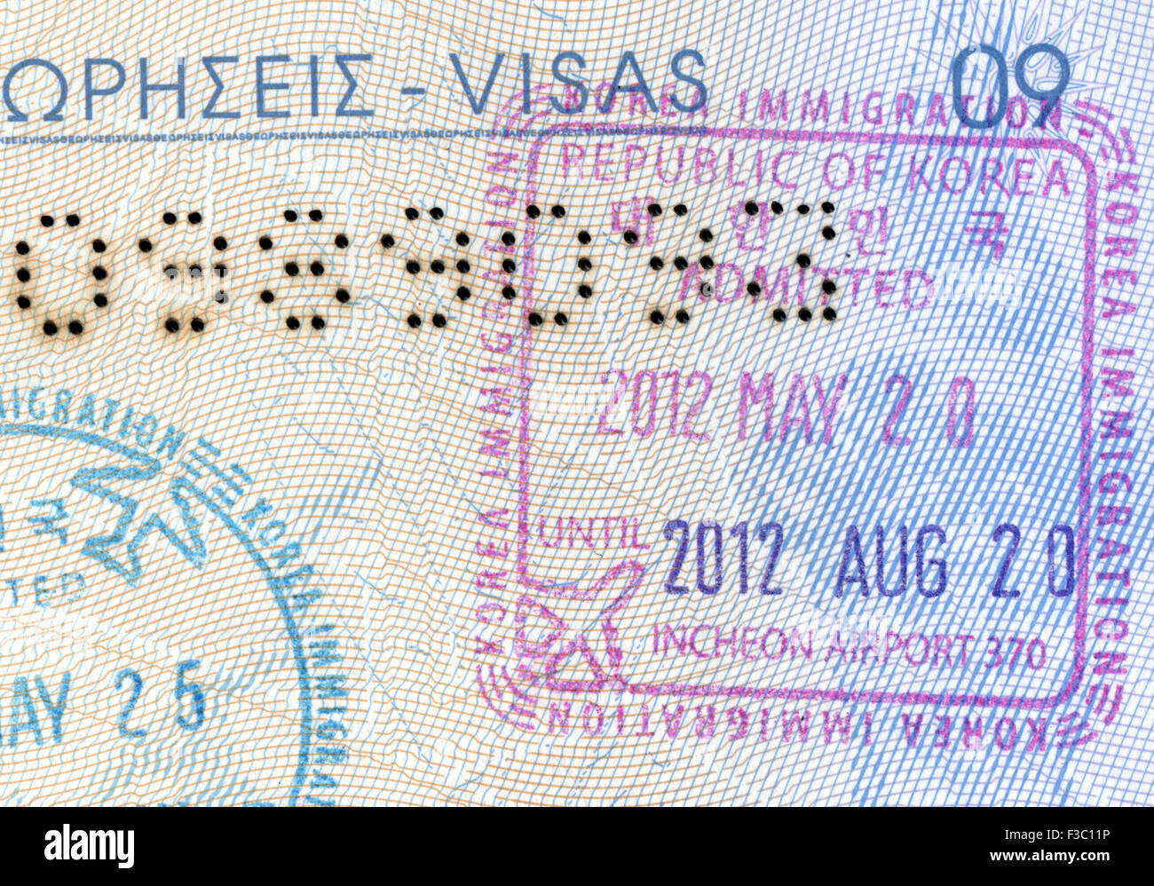 Visa stamps exit and entry - immigration arrival stamps on Greek passport Stock Photo