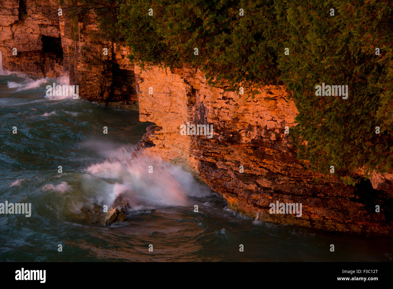 Rugged limestone ledges rise 20-40 feet above Lake Michigan, Cave Point County Park, Door County, WI Stock Photo