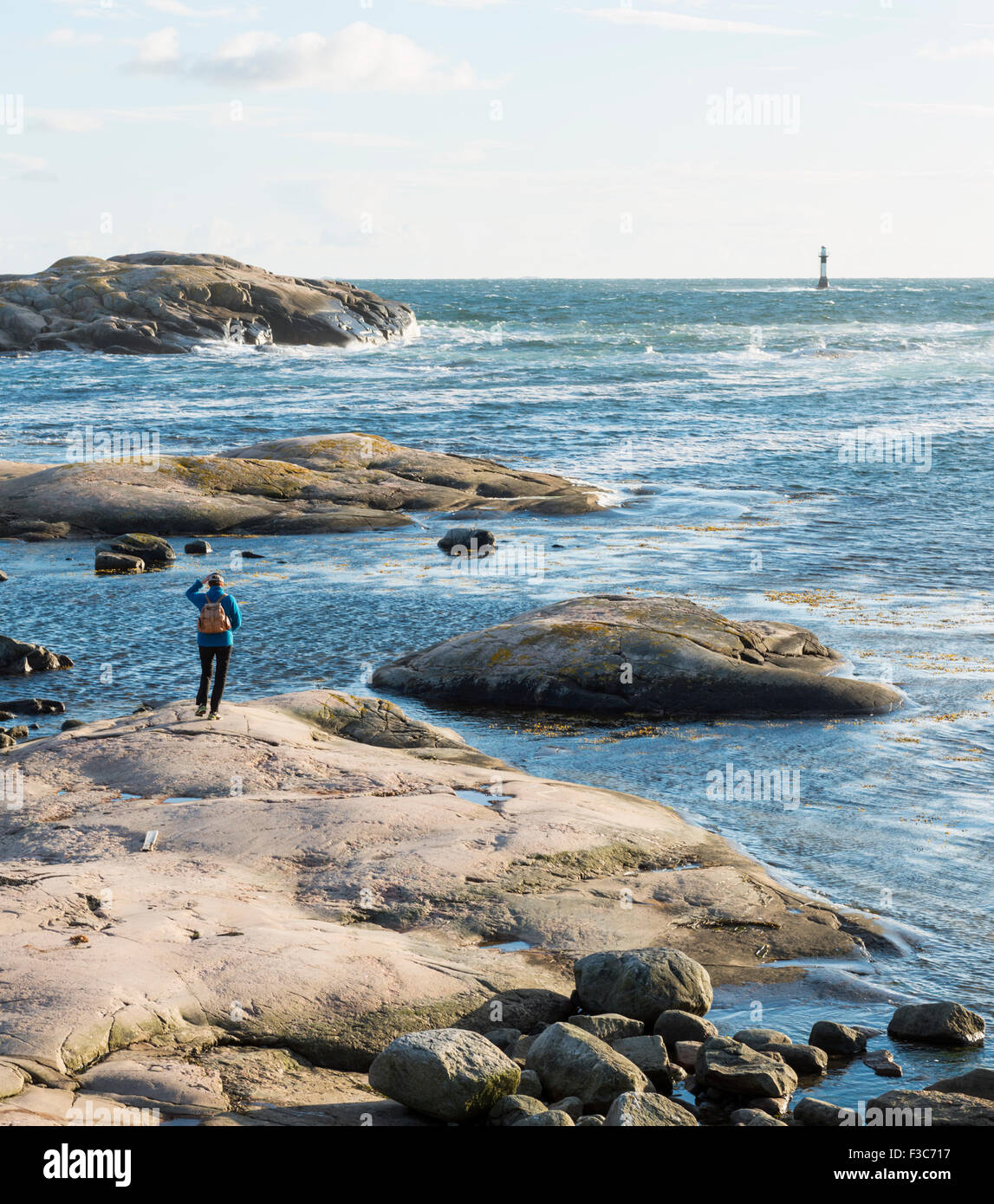 Woman on the shore, Sweden Stock Photo