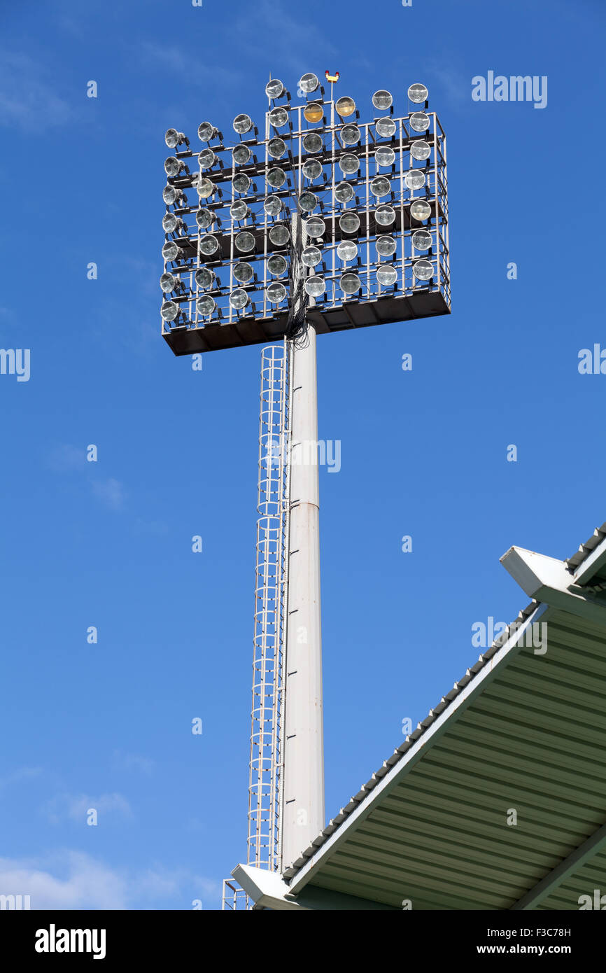 Stadium lights against blue sky background Stock Photo Alamy