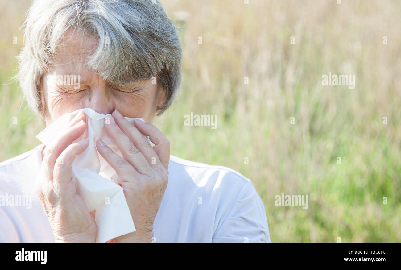 Old age woman using tissue Stock Photo
