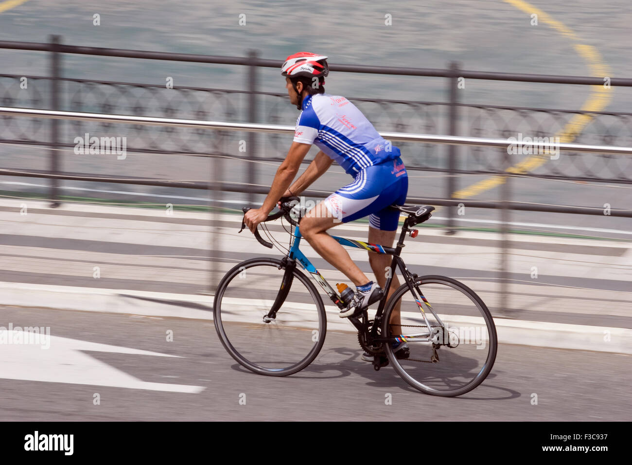 Cyclist riding bike Stock Photo - Alamy