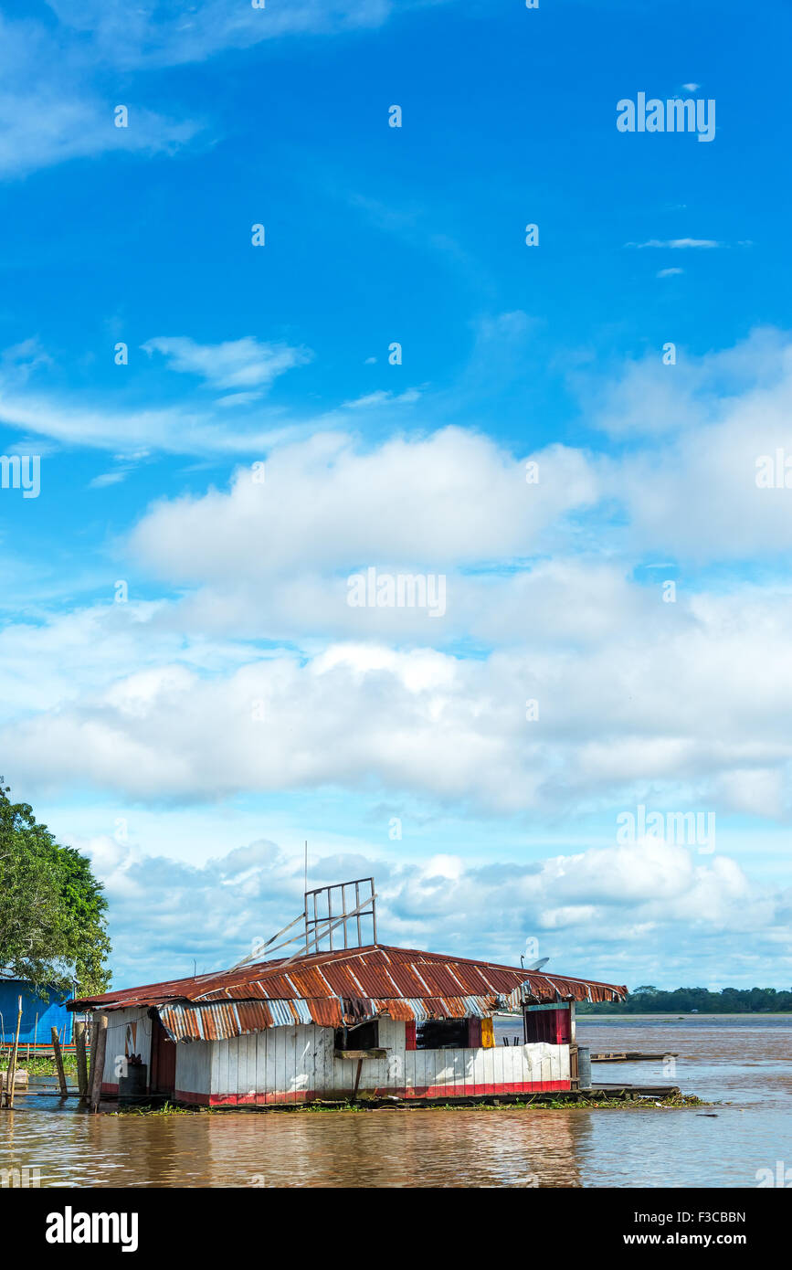 Floating shack on the Amazon River in Tamshiyacu near Iquitos, Peru Stock Photo