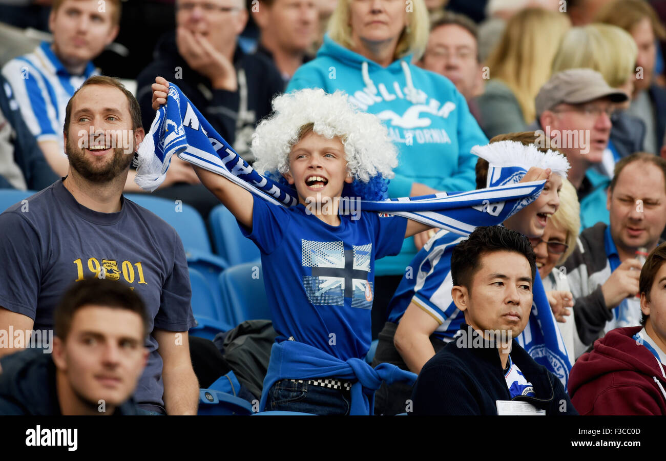 Young children boys Brighton and Hove Albion football club supporters fans with scarves Stock Photo