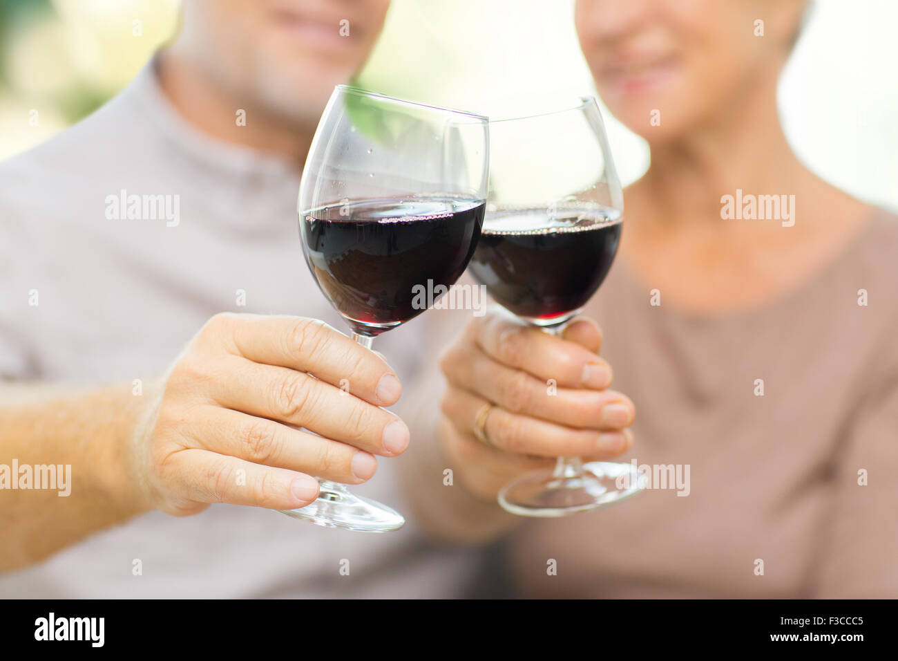close up of happy senior couple with red wine Stock Photo