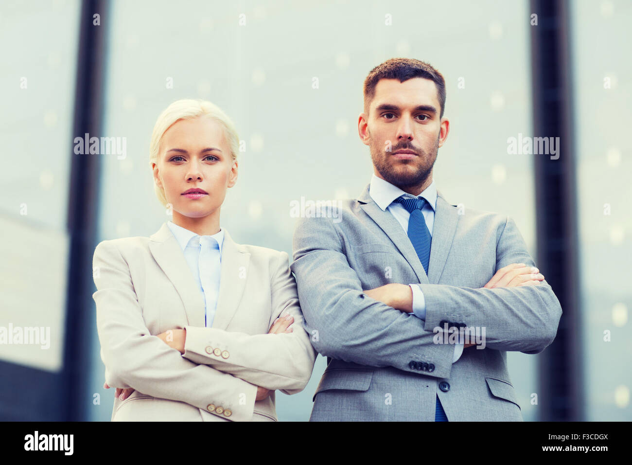 serious businessmen standing over office building Stock Photo - Alamy